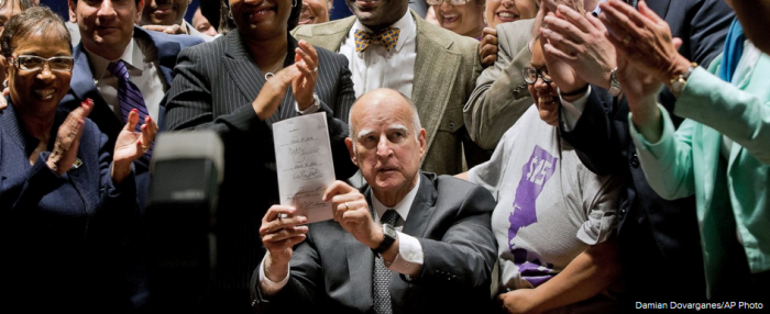 Governor Jerry Brown signs Fair Wage Act April 2016.png